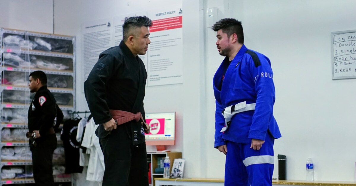 GJJ Singapore instructors speaking during a Brazilian Jiu-Jitsu class